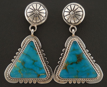 A set of dangle earrings with inlay turquoise.